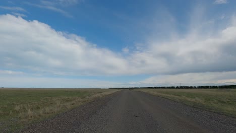 Off-road-cycling-across-vast-landscape-as-small-birds-take-flight---Kaitorete-Spit,-Canterbury