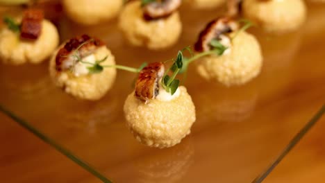 eel canapés on a glass tray