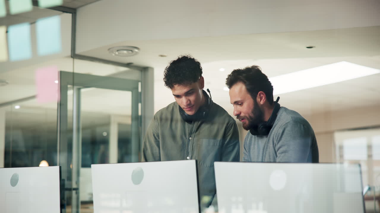 Two men working together in an office setting