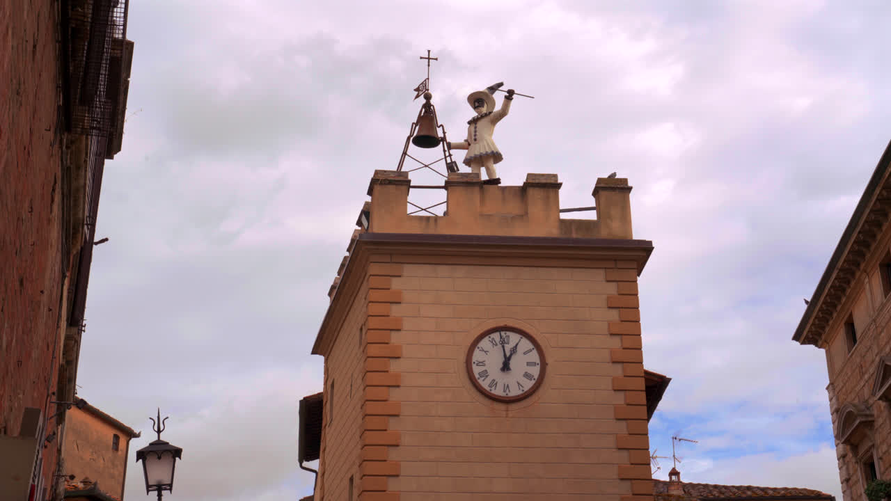 Clock tower and stone church in Montepulciano square showcasing renaissance architecture