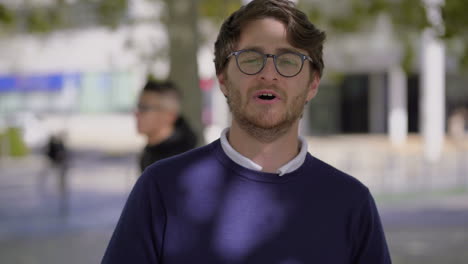 Bearded-man-in-eyeglasses-talking-at-camera