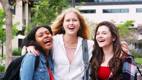 portrait of female high school students outside college buildings