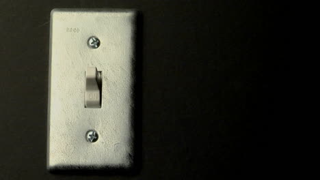 a light switch sits in the on position