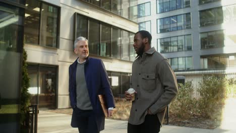 businessmen discussing outdoors