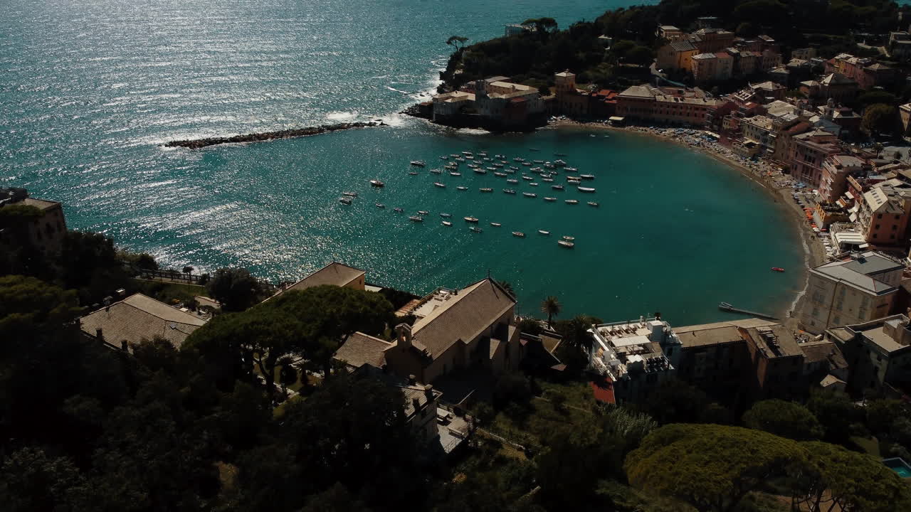 Aerial view of a beautiful Italian coastal town with boats in the bay