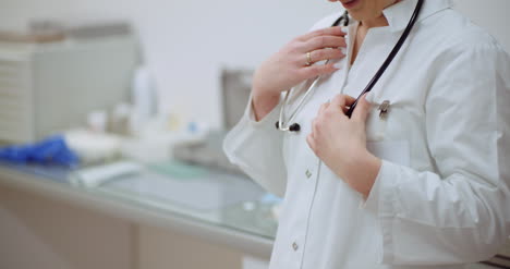 positive doctor puts on stethoscope and smile 4