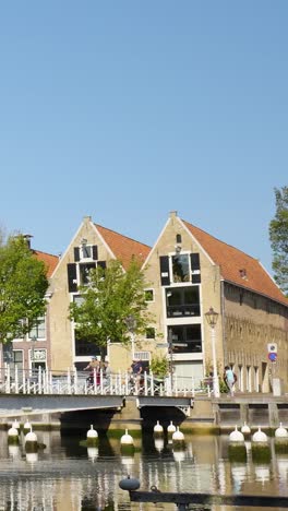 dutch town with canal and bridge