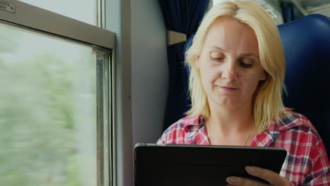 Woman-Uses-Tablet-on-a-Train