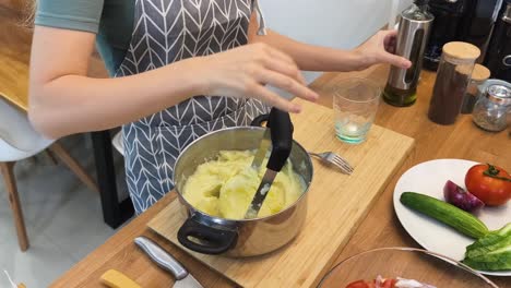 woman making mashed potatoes