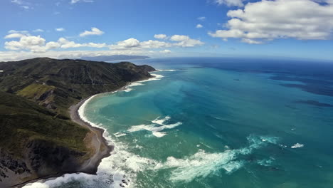 aerial shot of the rugged coastline of the north island near wellington, new zealand