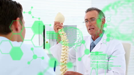 animation of medical data processing over caucasian male doctor and patient discussing spine