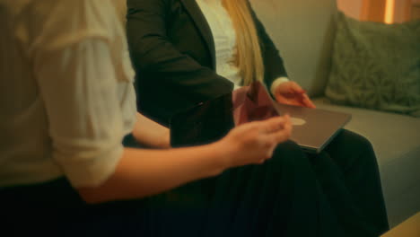 two women talk during evening meeting and discuss business matters