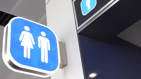 unisex restroom sign at airport
