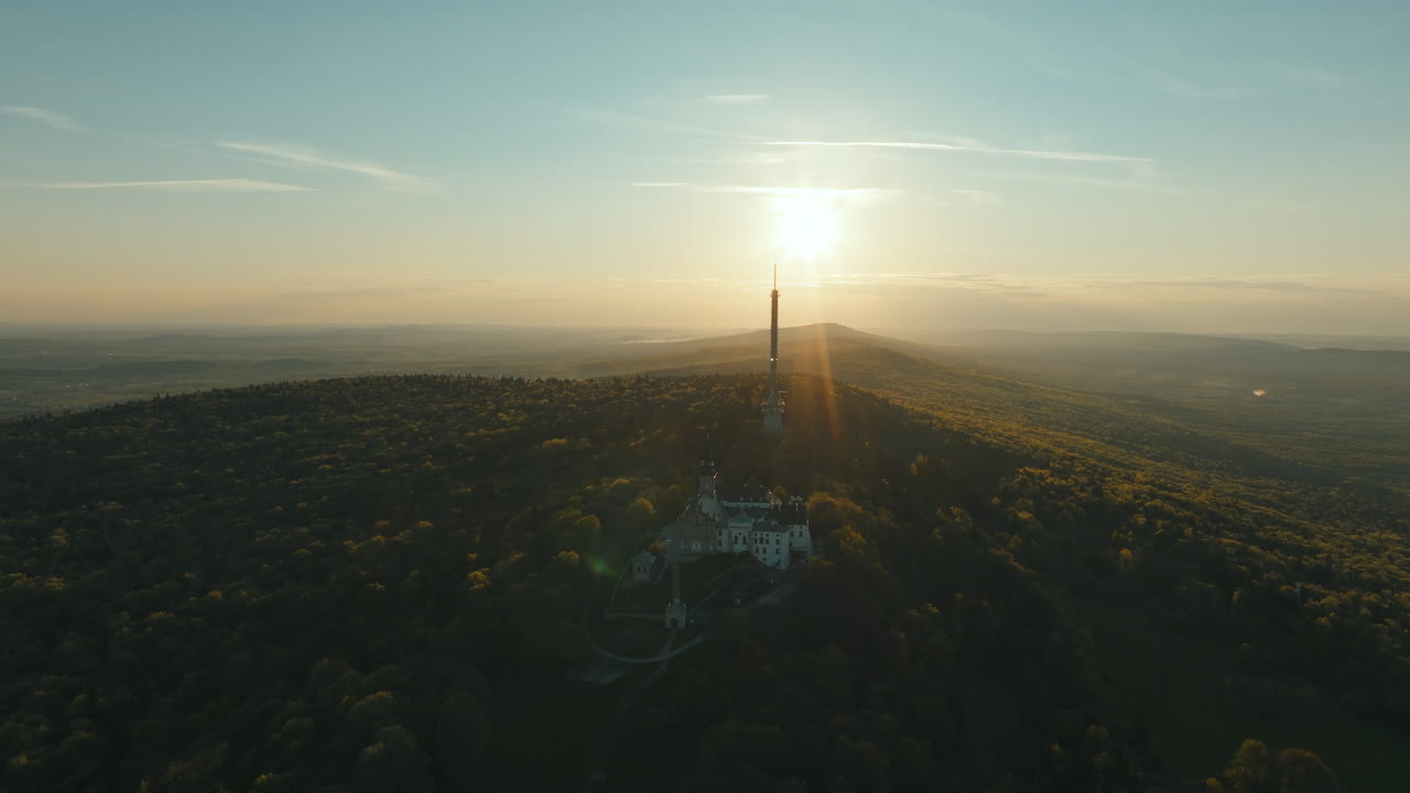 Aerial View of a Castle on a Mountain at Sunset