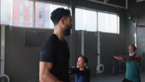 fitness instructor guiding students in a gym class