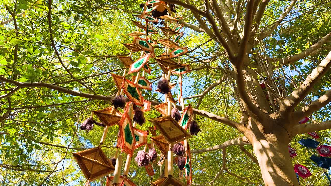 Traditional mobile swaying in a tree canopy