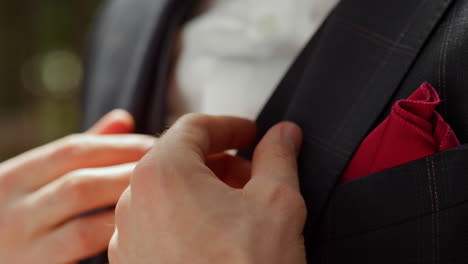 man hands touching bow tie. unrecognizable man preparing for wedding ceremony