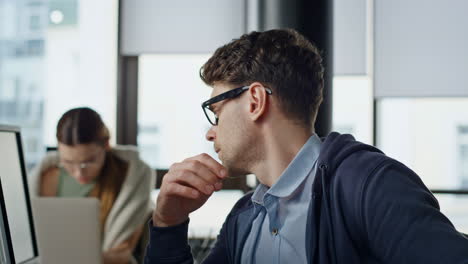 overwhelmed manager working computer closeup. tired thoughtful man rubbing eyes