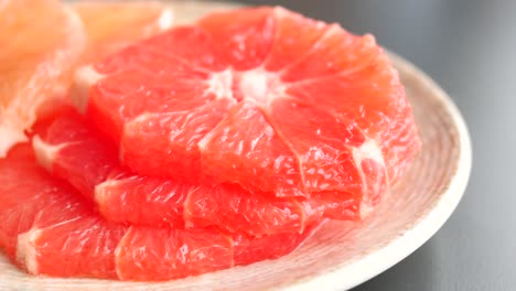 fresh grapefruits on a plate ,