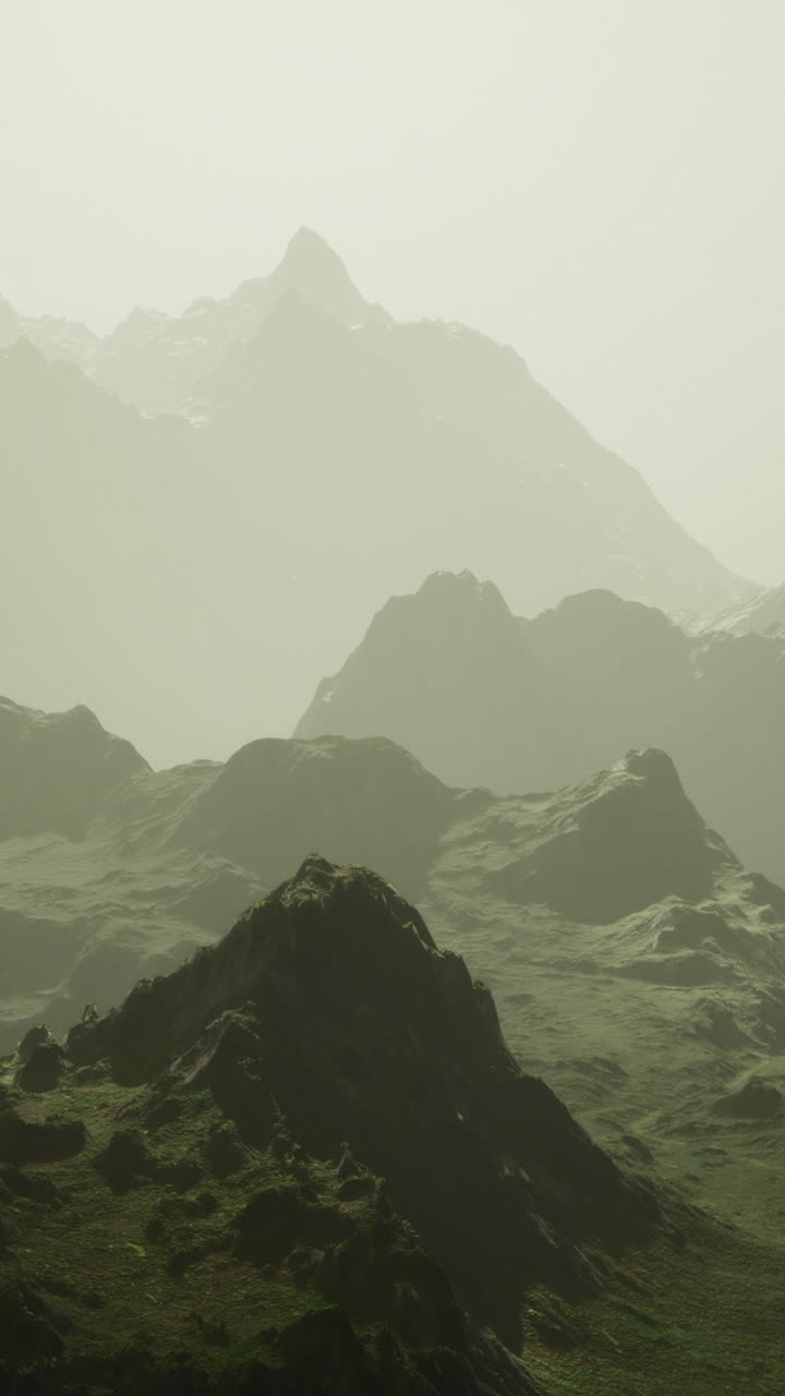 Mountain landscape with misty peaks and lush valleys at dawn