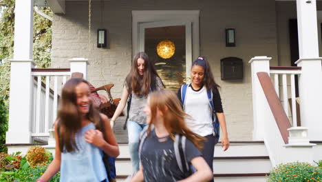 four teen girlfriends leaving house for school