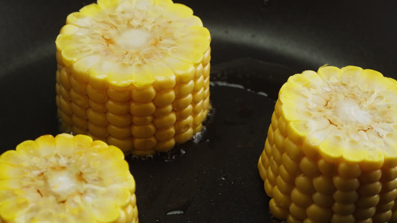 Fresh Corn on the Cob Frying in a Hot Pan