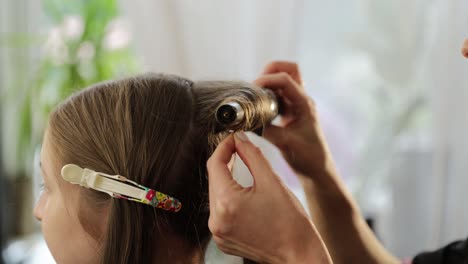 skilled makeup artist expertly applies makeup on a model in a professional studio setting