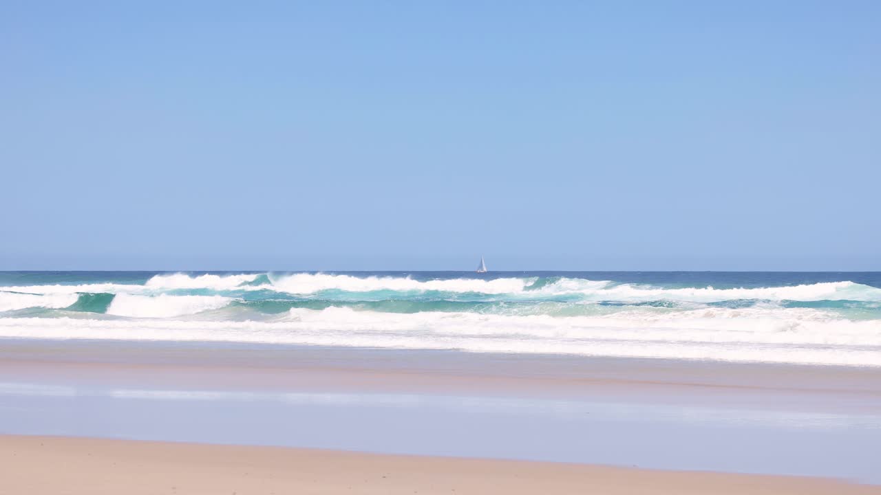 Peaceful ocean waves lapping on a sandy beach