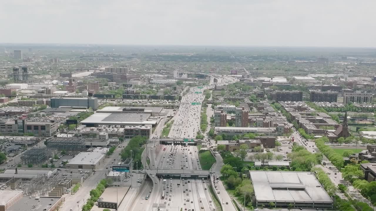 View of Chicago city from above with busy highway and buildings