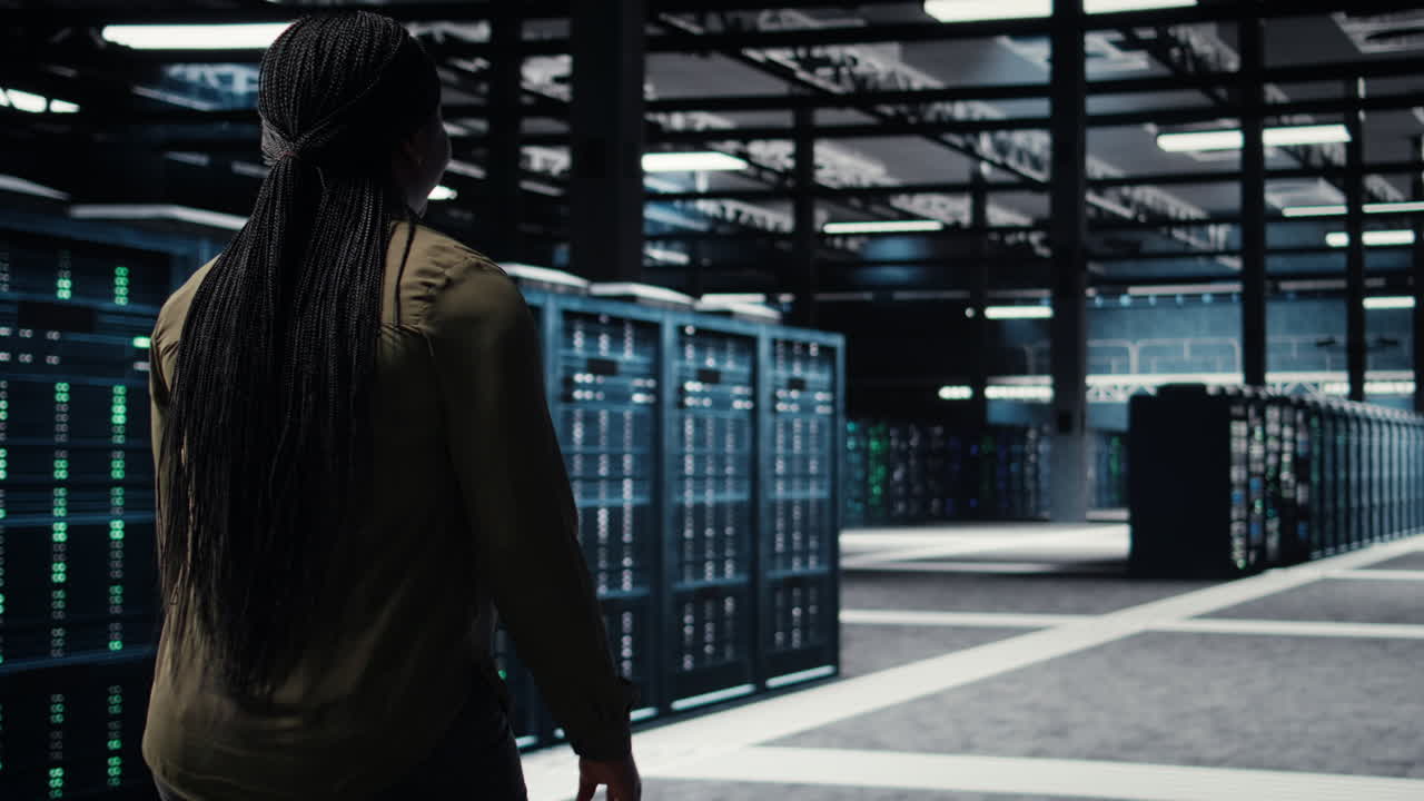 Programmer overseeing server farm, ensuring compliance with industry standards