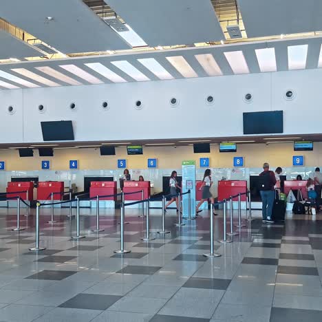 queue of people waiting at boarding gate at airport