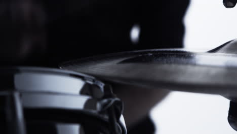 close up of drummer playing drum kit in studio shot on r3d