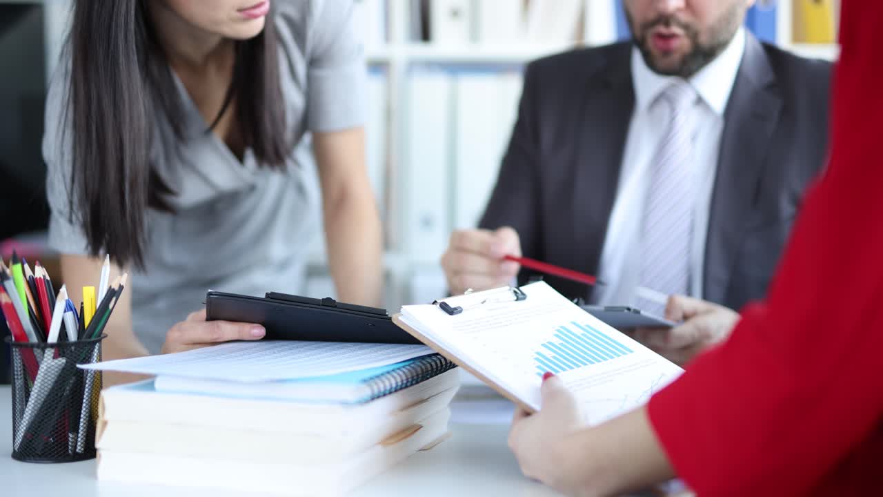 Business meeting with charts and documents in the office