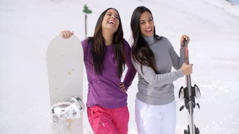 Two-attractive-female-friends-at-a-ski-resort