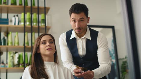 handheld view of hairstylist choosing of color to hair dye