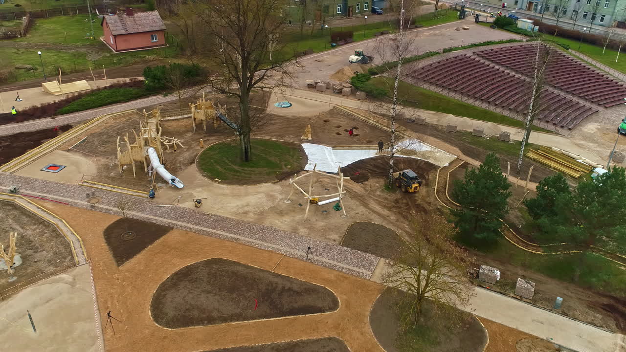 Aerial view overlooking a bulldozer moving soil on a park construction site