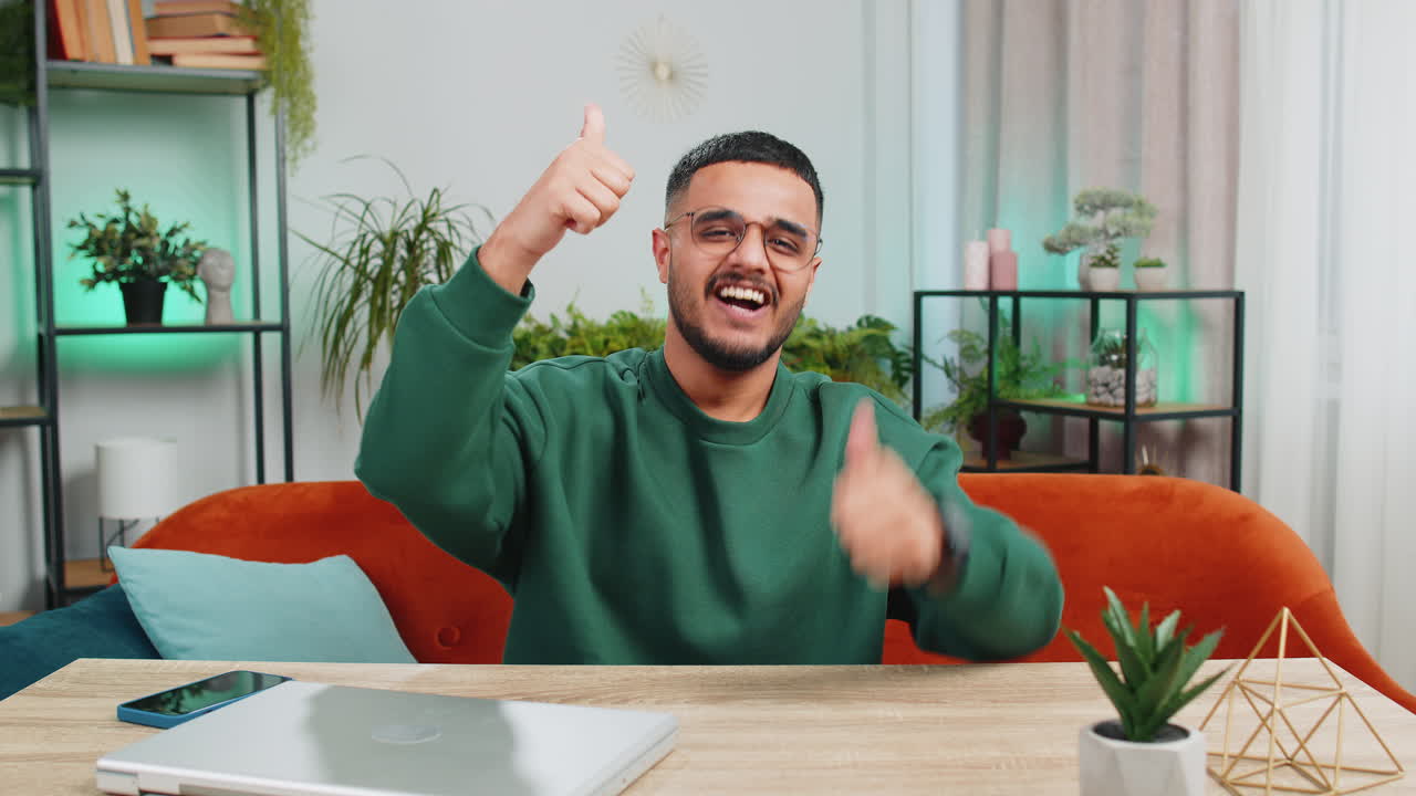 Excited happy indian man surprised shocked by sudden victory good win news celebrate wow reaction