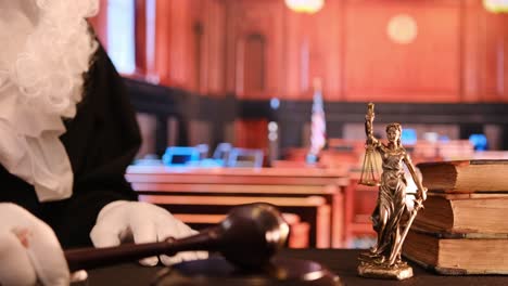 a detailed courtroom scene depicting a gavel, a statue of lady justice, and an american flag symbolizing law and order