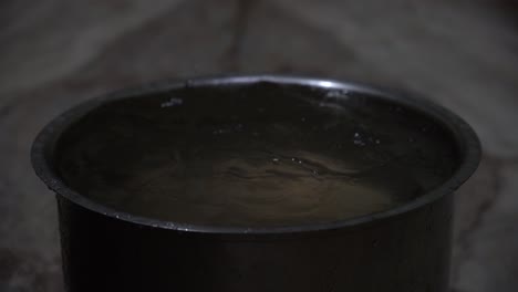 roof of house leaking during heavy rains and filling a utensil kept under it