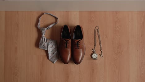 groom accessories arranged neatly for wedding preparation flat lay