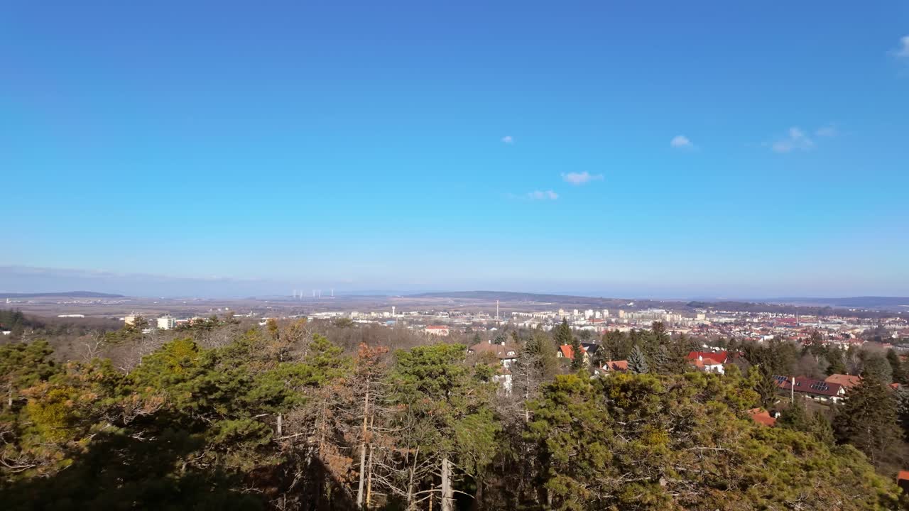 Panoramic view of Sopron downtown and the surrounding area from the Sorhazdombi Lookout on a sunny day in Hungary.