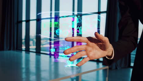 hand interacting with holographic data visualization display