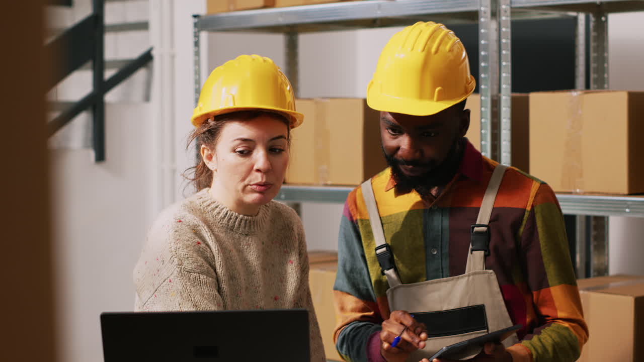 Warehouse employees working together