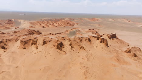 sandstone rocks - flaming cliffs , gobi desert in mongolia - drone shot