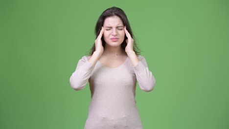 young stressed woman having headache