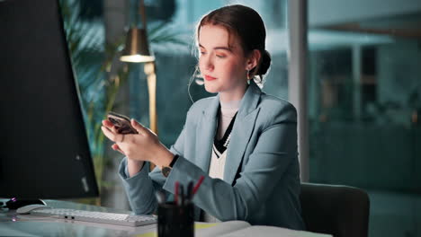 woman using mobile phone in office