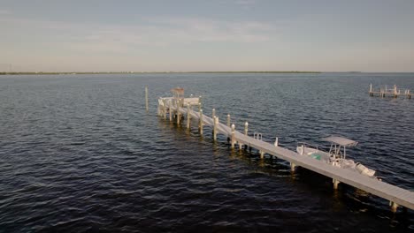 aerial drone of small private pier in the florida keys waters sunset