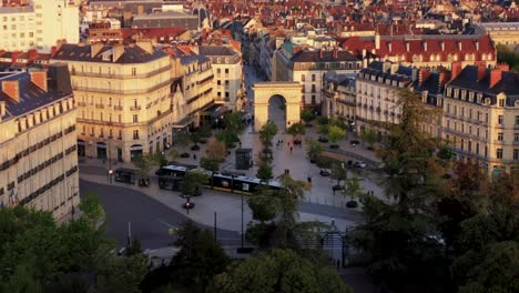 Dijon-City-Center-with-public-transpiration-during-golden-hour-drone-HD-30p