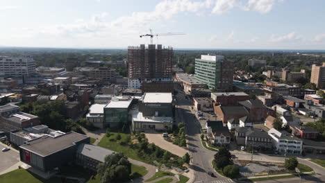 aerial orbit showcasing panoramic view of growing urban city center