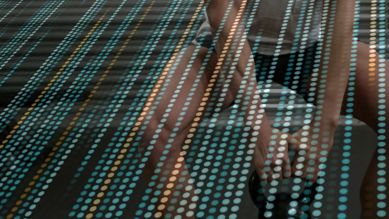 Male trainee gripping kettlebell, hinging and swinging for fitness, dotted pattern overlaying scene